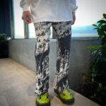 O.U.E.E newspaper printed pants Small